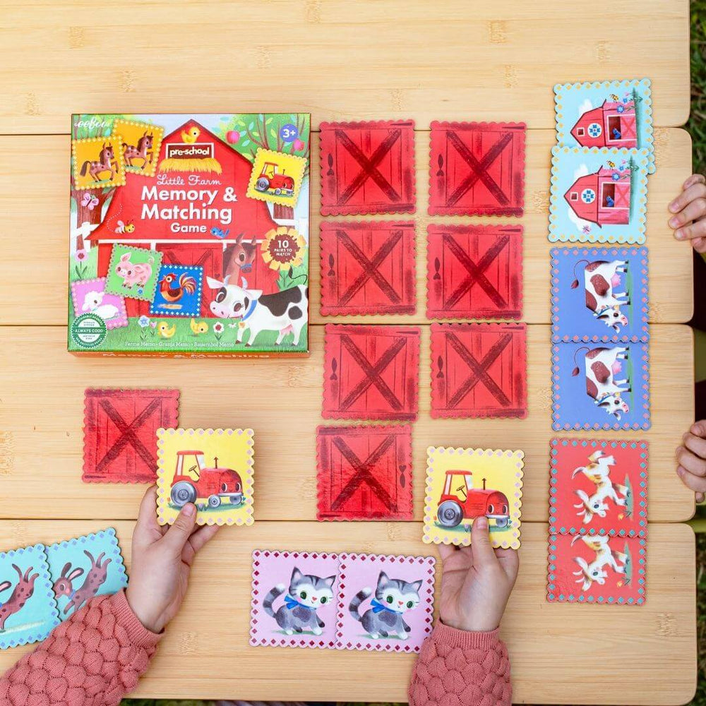Children playing the eeBoo Little Farm Memory & Matching Game.