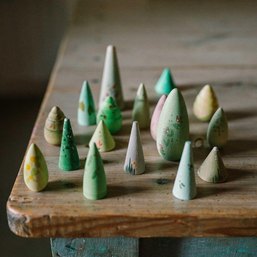 Grapat Forest Trees wooden toy set for small world play, featuring 18 nature-inspired tree pieces set on a wooden table - Bella Luna Toys