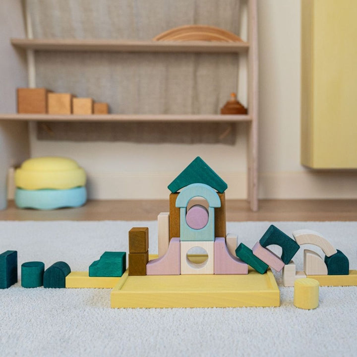 A structure build with wooden blocks from Grimm's Wooden Toys Tiny Art Collection