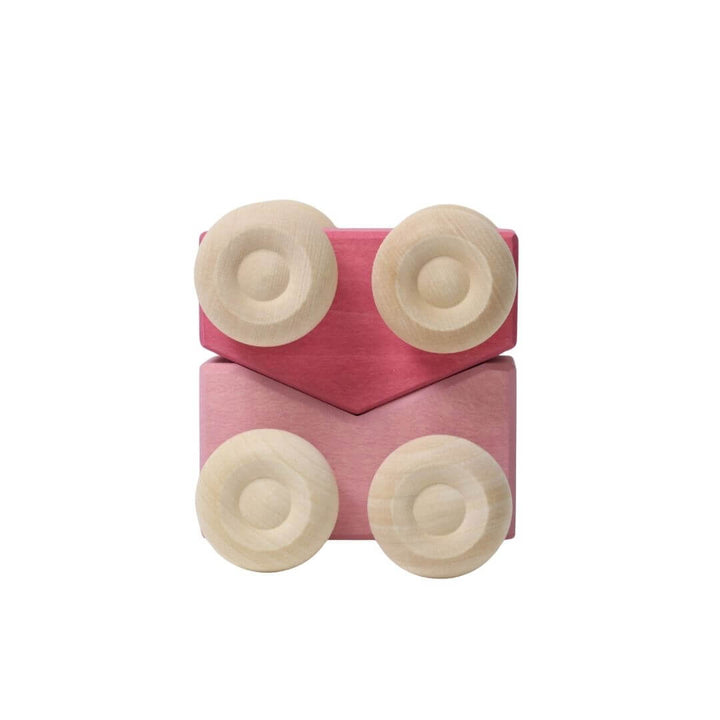 The pale pink and magenta pink colorful wooden stacking cars by Grimm’s, handcrafted in assorted rainbow hues for open-ended play and building fun - Bella Luna Toys