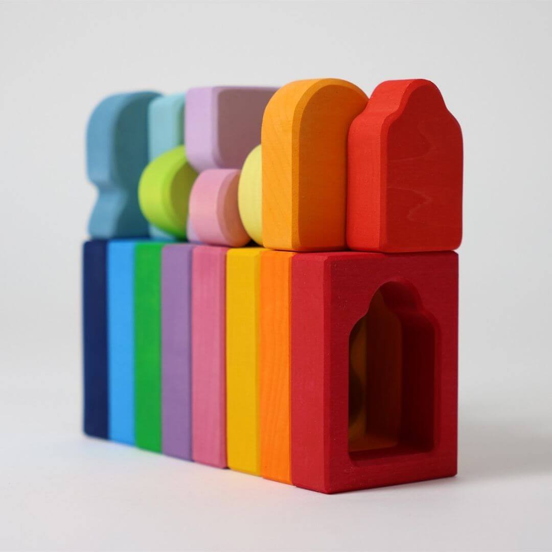 Close-up of Grimm’s Windows Wooden Building Set pieces in bright rainbow colors and varied window-like shapes, perfect for stacking and sorting. Bella Luna Toys 