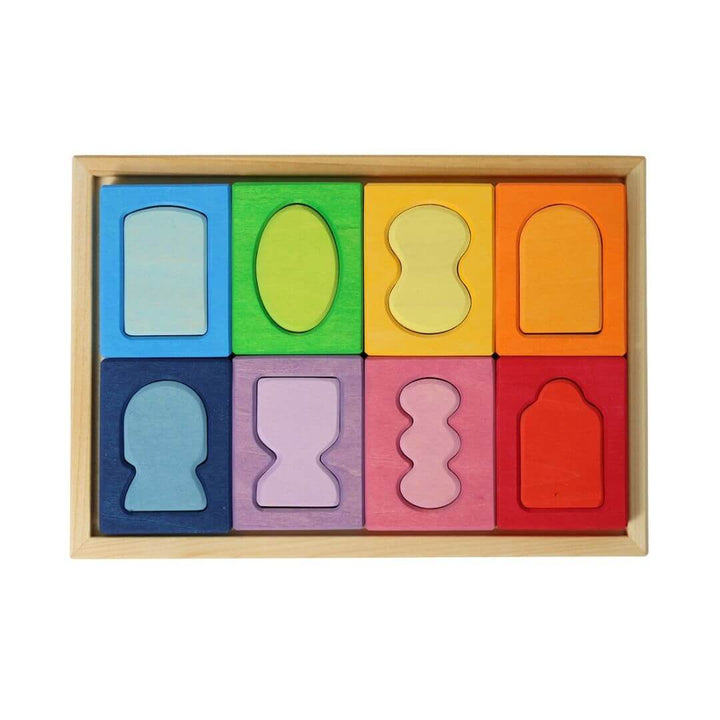 Colorful Grimm’s Windows Wooden Building Set with uniquely shaped wooden blocks in rainbow hues, perfect for open-ended building and shape exploration. Bella Luna Toys 