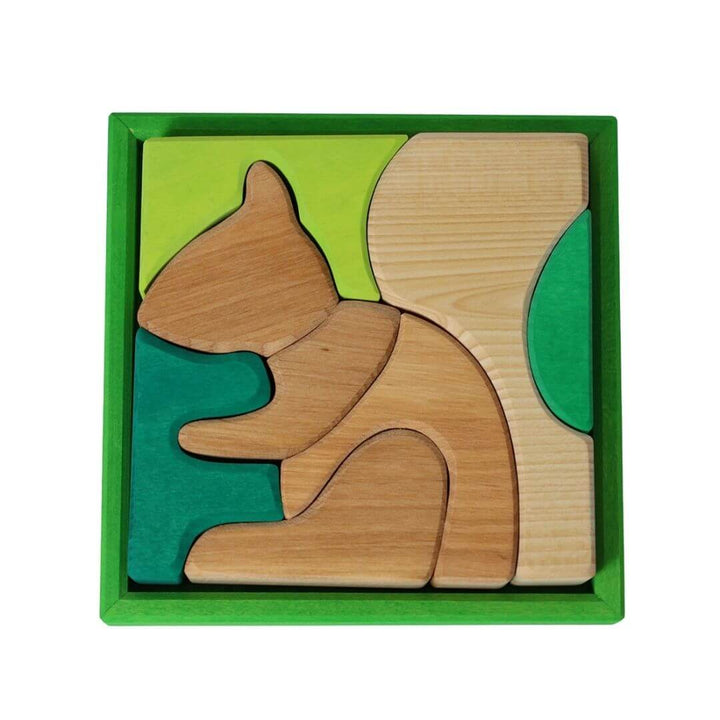 Grimm’s Wooden Puzzle and Building Set in green, showing a playful squirrel design surrounded by soft green tones inside a wooden frame. Bella Luna Toys
