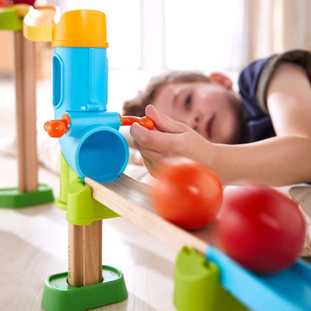 Kullerbu Rainbow Run Bundle with boy playing with 2 balls and the track