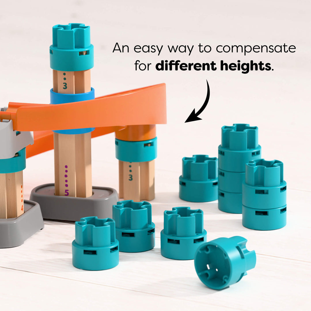 Toy building set with blue height-compensating blocks on a white background