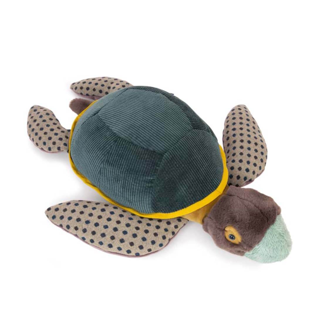 A plush sea turtle toy with a dark teal corduroy shell, brown head, beige flippers with black polka dots, and a mint green beak, shown on a white background.