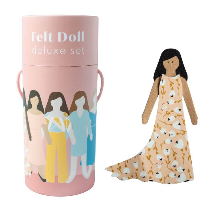 Deluxe Felt Doll Set from Lowercase Toys in pink tube packaging with illustrated dolls, shown with one felt doll wearing a floral dress.