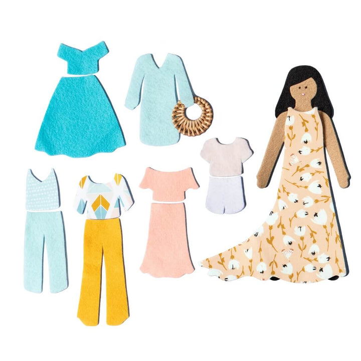 Lowercase Toys felt doll with floral dress, clothing pieces, and pink Felt Doll Set package arranged on white background.