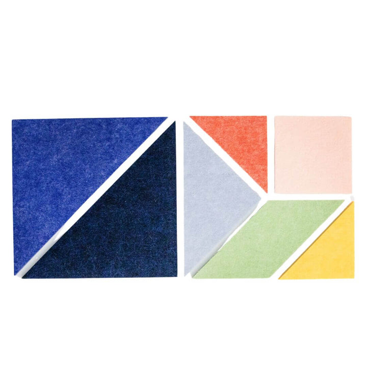 Colorful felt Tangram puzzle pieces from Lowercase Toys arranged on a white background, showing the full 7-piece set.