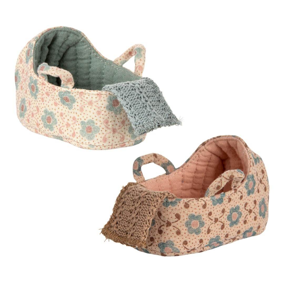 Two Maileg baby mouse carrycots in floral fabrics with tiny handles and blankets, shown in two colorways. Bella Luna Toys.