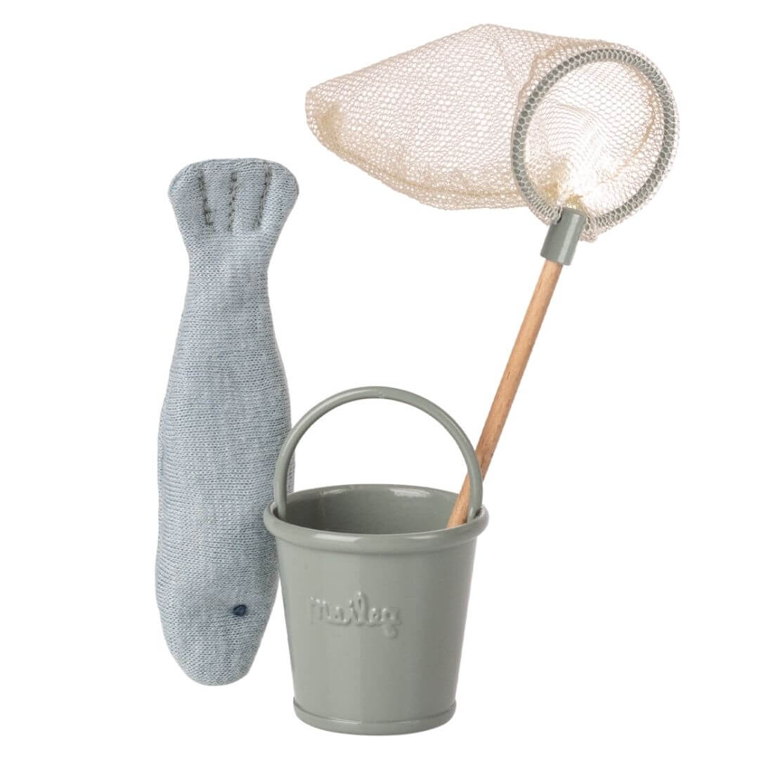 Mouse-sized Maileg fishing set including a fabric fish, light green metal bucket, and mesh fishing net with wooden handle