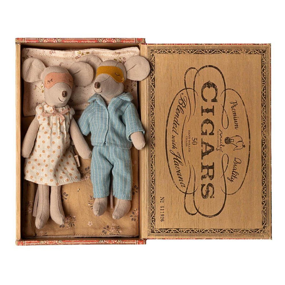 Maileg Mom and Dad Mouse with sleep masks on in vintage-style cigar box bed with pajamas and blanket, from Bella Luna Toys.