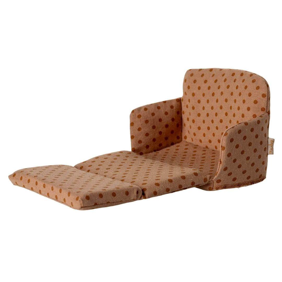 Maileg mouse-sized sofa bed in peach polka dotted fabric unfolded into a doll-sized bed, from Bella Luna Toys.