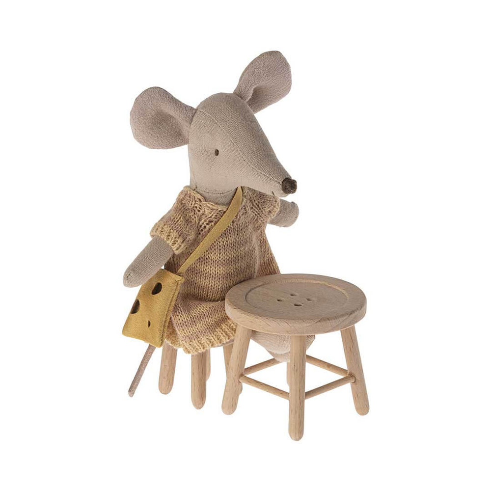 Maileg Sister Mouse in knit dress with polka dot purse sitting on Mouse Sized Stool at Mouse Sized Table