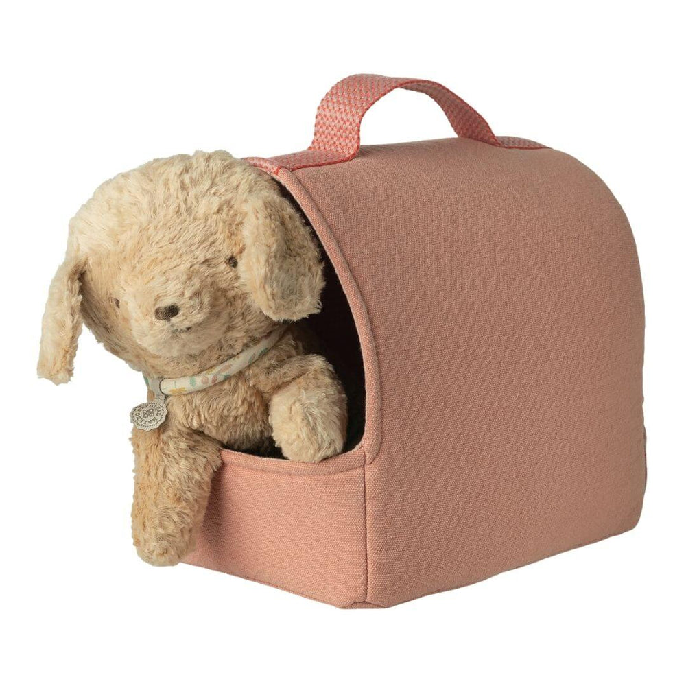 Maileg pet carrier in coral fabric with handle, front and side pockets, with puppy peeking out. - Bella Luna Toys