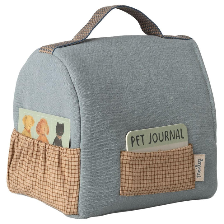 Maileg pet carrier in dusty blue fabric with handle, front and side pockets, including pet journal ID card for Maileg puppies and animals. - Bella Luna Toys