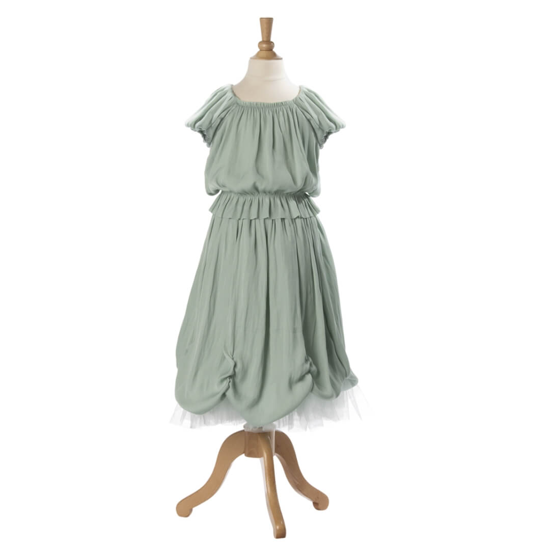 Green dress on a mannequin against a white background