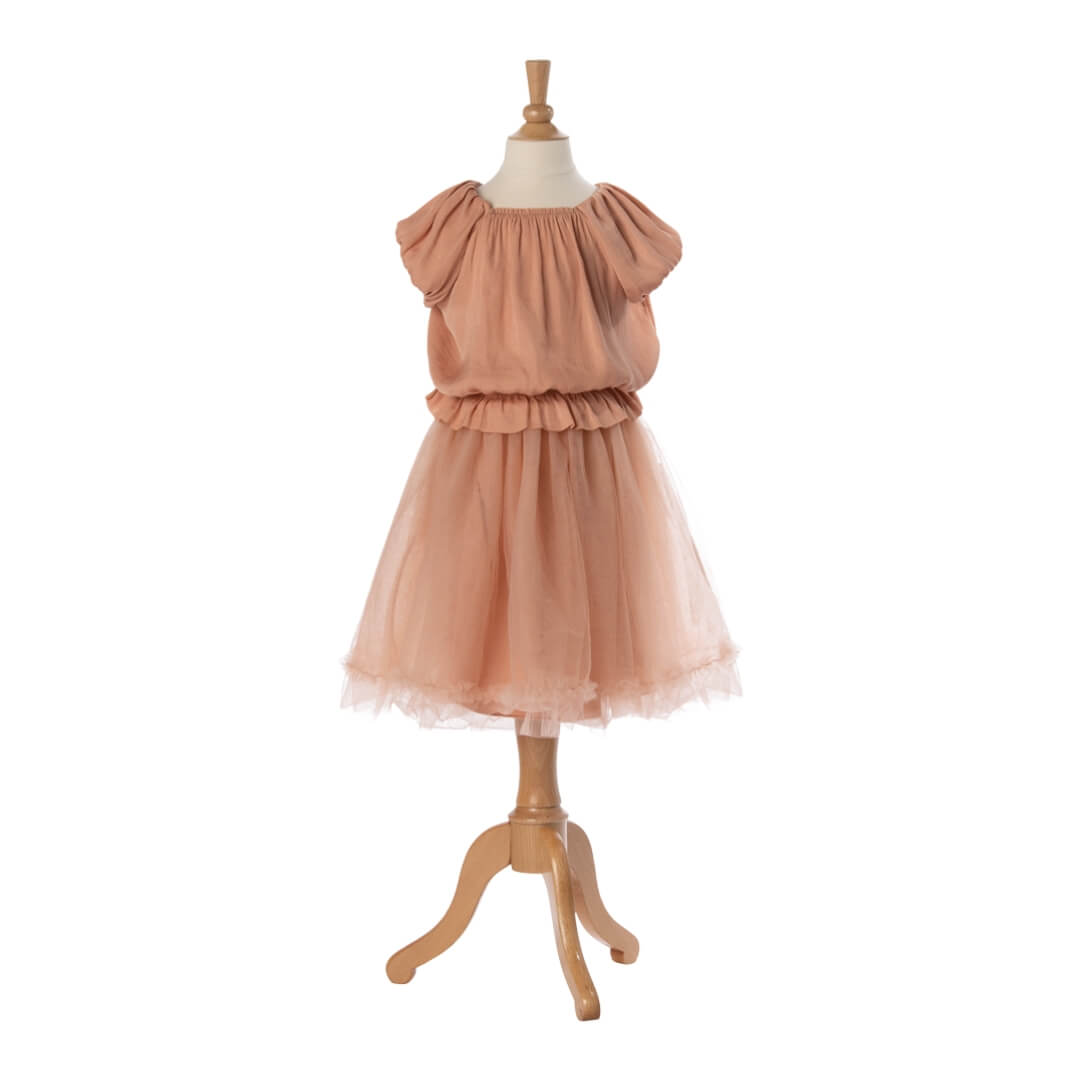 Pink dress on a mannequin against a white background