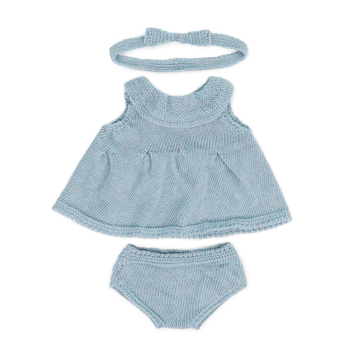 A knitted soft blue 3-piece outfit for 15-inch Miniland Dolls, featuring a soft knit dress, matching bloomers, and a headband in natural tones, made from recycled materials for an eco-friendly touch.