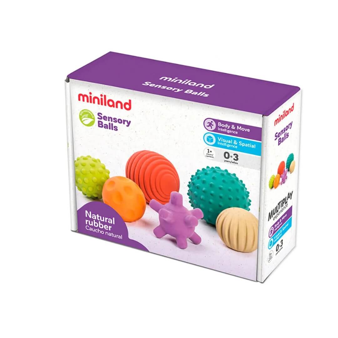 Boxed set of Miniland Natural Rubber Sensory Balls, including six colorful textured balls in various shapes and sizes, designed for babies and toddlers to grasp, roll, and explore.
