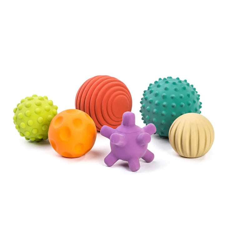 A set of Miniland Natural Rubber Sensory Balls, including six colorful textured balls in various shapes and sizes, designed for babies and toddlers to grasp, roll, and explore on a white background. 