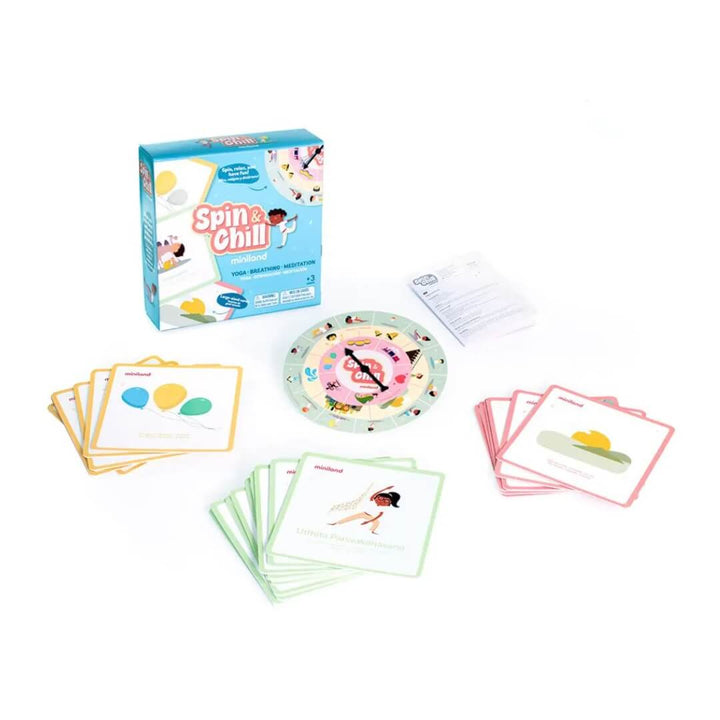Miniland Spin & Chill Mindfulness Game set with illustrated box, colorful activity cards, round spinner board, and instruction sheets displayed on a white background.