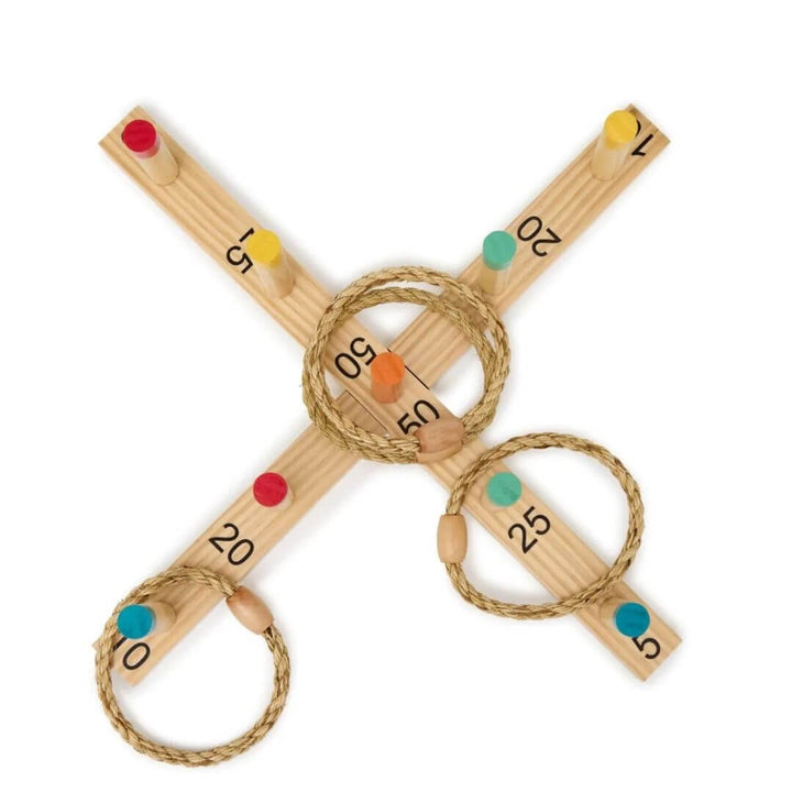 Miniland - An overhead view of the Wooden Miniland ring toss game featuring numbered scoring pegs, colorful target posts, and natural rope rings arranged on a cross-shaped wooden base - Bella Luna Toys
