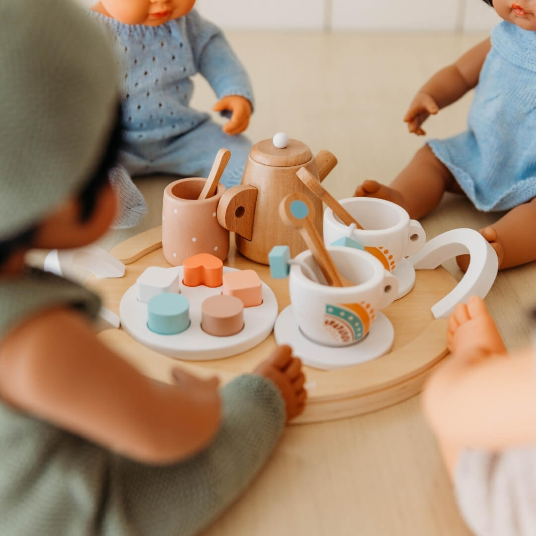 A close up shot of the Miniland wooden tea set.