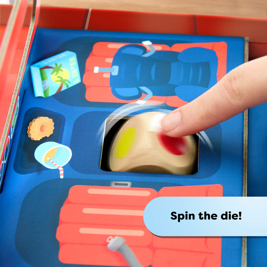 Hand spinning a die on a colorful game board with text 'Spin the die!'.