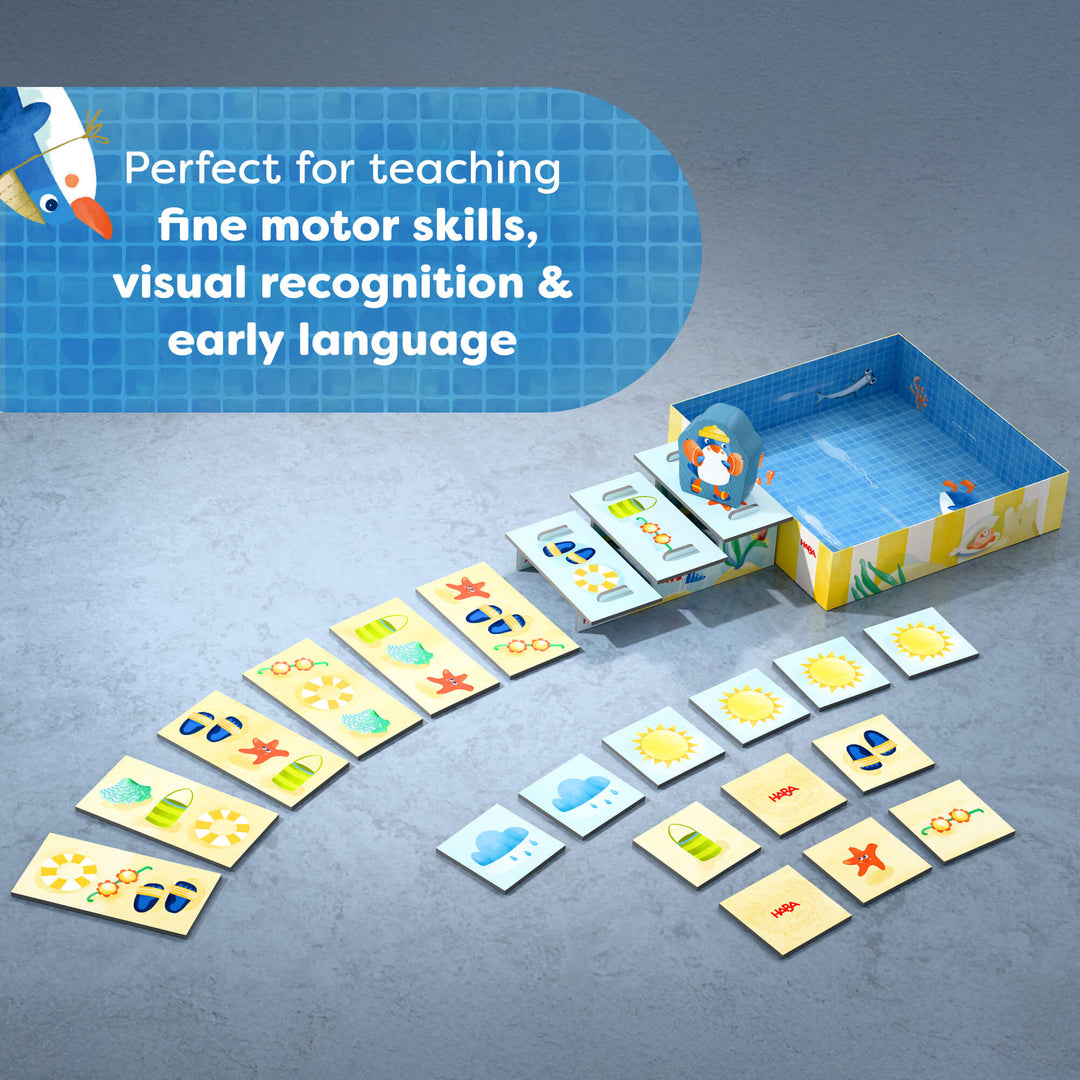Pete Ahoy Penguin game set with cards and a box on a gray background, featuring text about teaching skills.