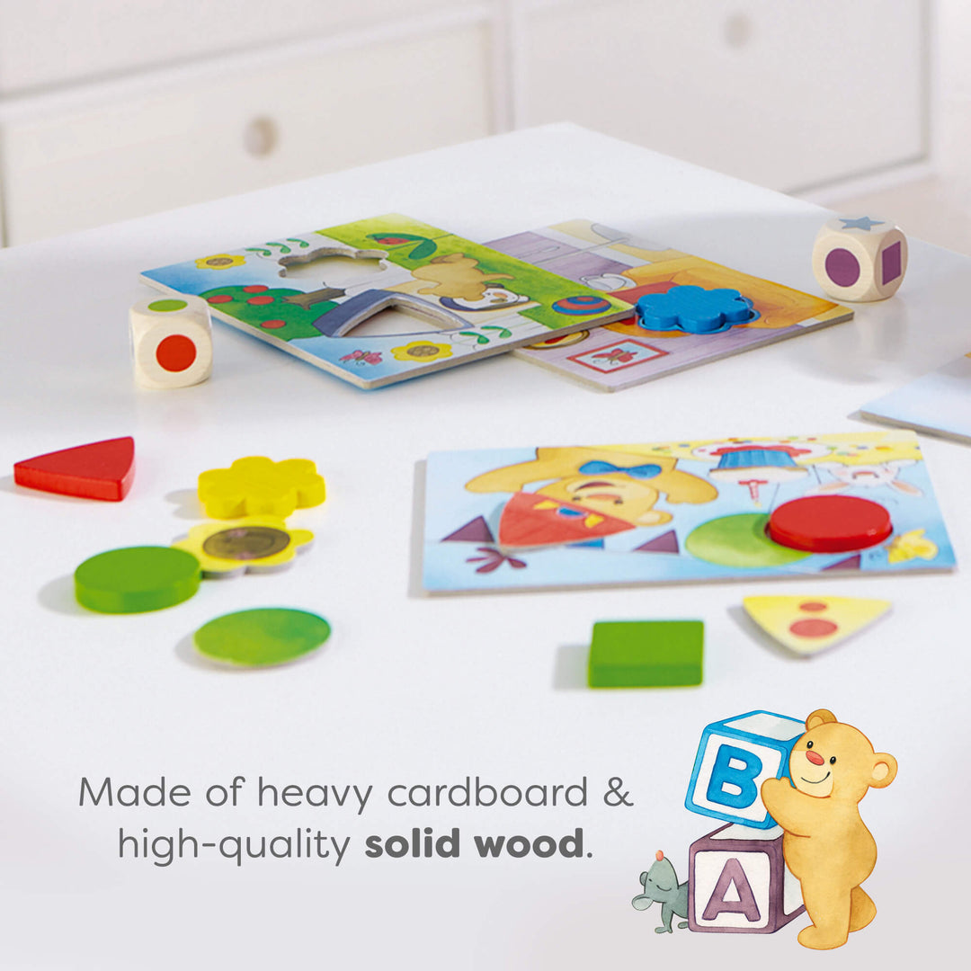 Colorful educational puzzles on a white surface. Text reads "Made of heavy cardboard & high-quality solid wood."