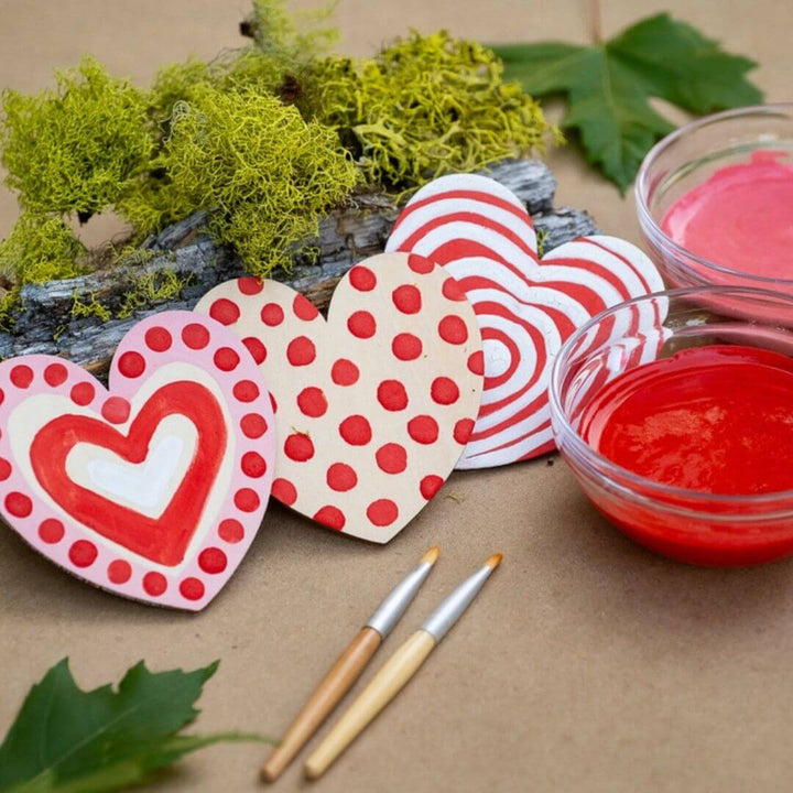 Painted red wooden hearts from the Natural Valentine's craft kit.