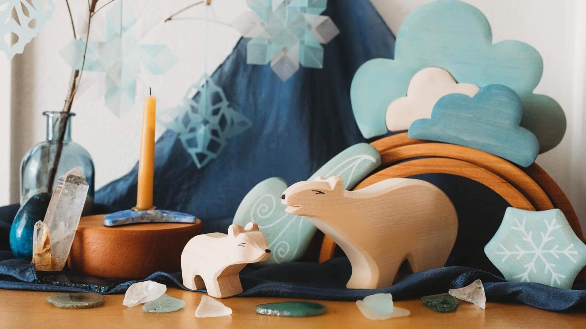 Ostheimer wooden animal figurines on a table with decorative elements