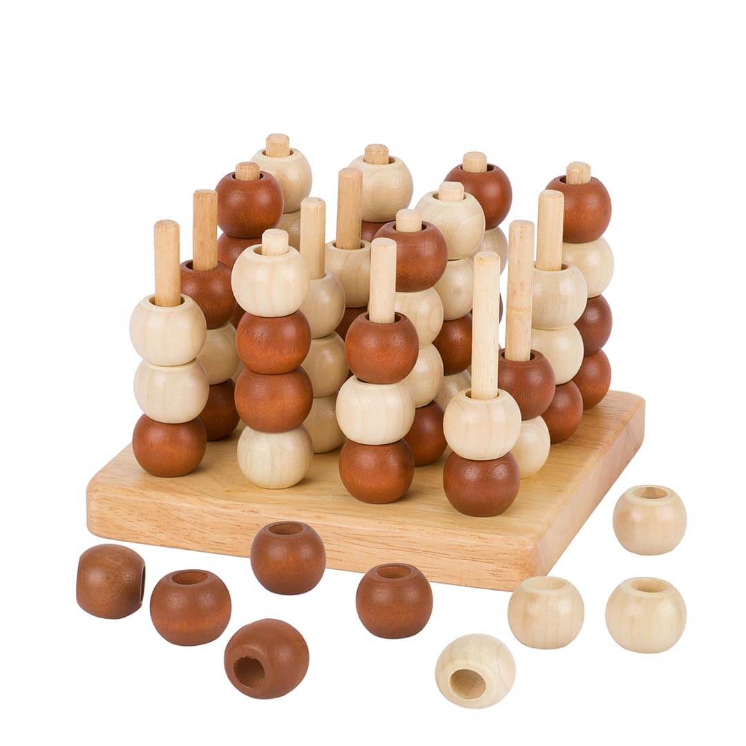 A wooden bead sorting toy with round natural wood beads on vertical pegs, set on a rectangular wooden base with several loose beads scattered in front, photographed on a white background.