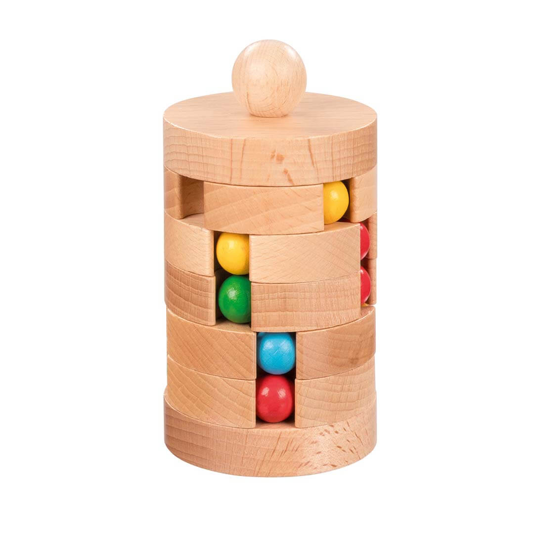 A wooden cylindrical toy puzzle with stacked natural wood rings and colorful spherical pieces in yellow, green, blue, and red, shown on a plain white background.