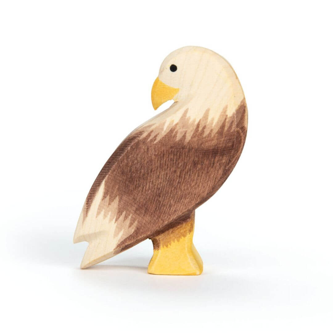 Ostheimer Bald Eagle handcrafted wooden figure with hand-painted white head, brown body, and yellow beak - Bella Luna Toys