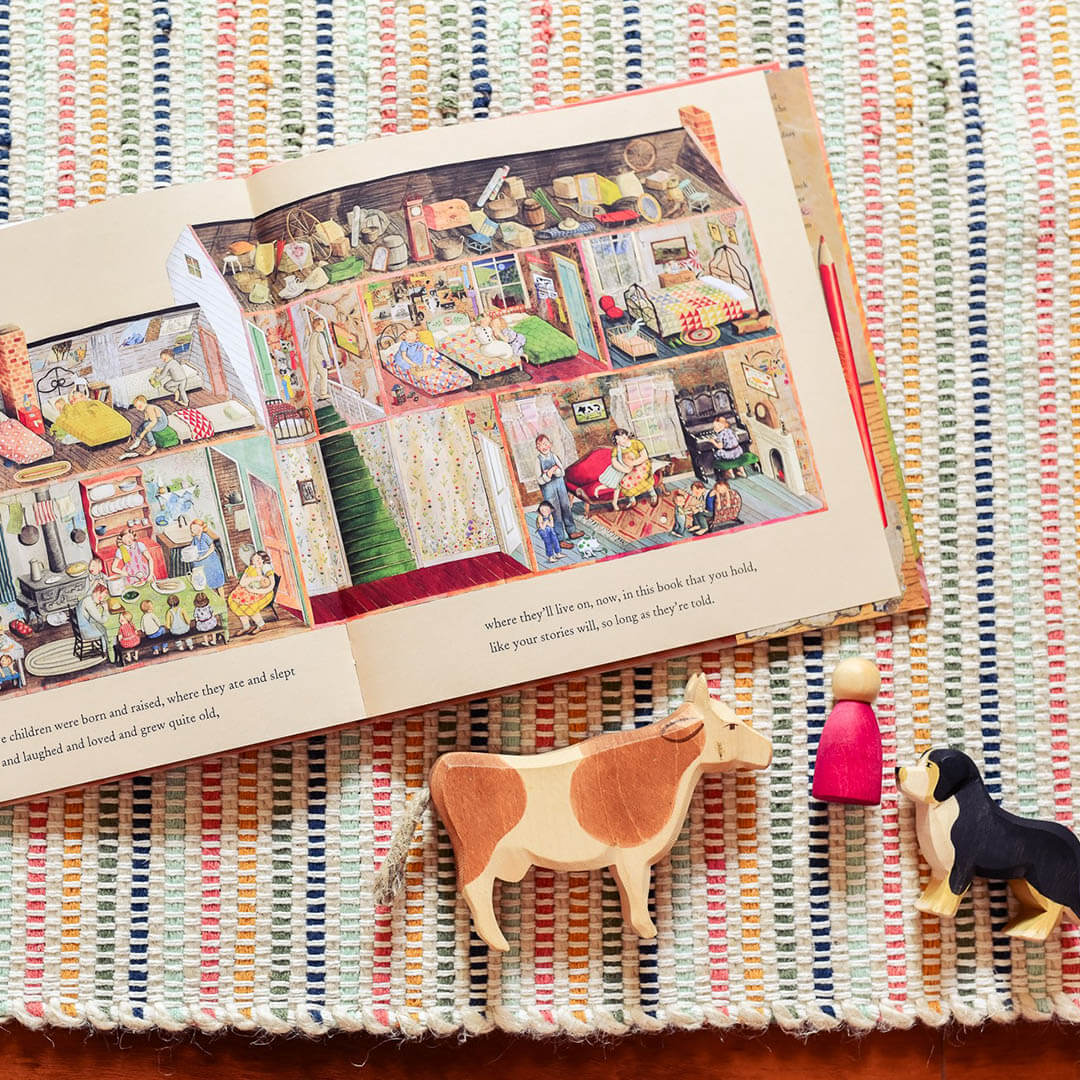 The Farmhouse Book on a multicolored carpet.