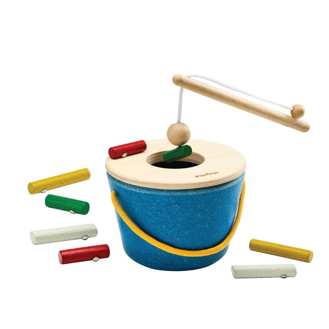 PlanToys Montessori Magnetic Fishing Set with blue wooden bucket, magnetic rod, and colorful timber pieces to catch and drop inside.