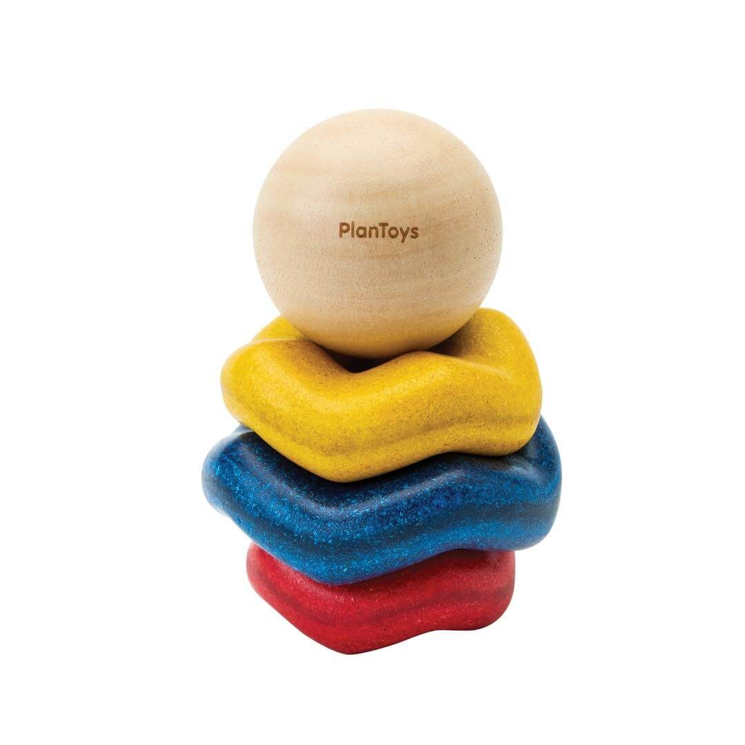 PlanToys Montessori Ball and Wave Stacker with wooden ball topper and three colorful wave-shaped pieces made from eco-friendly PlanWood®.