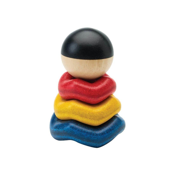 PlanToys Montessori Ball and Wave Stacker with wooden ball topper and three colorful wave-shaped pieces made from eco-friendly PlanWood®.