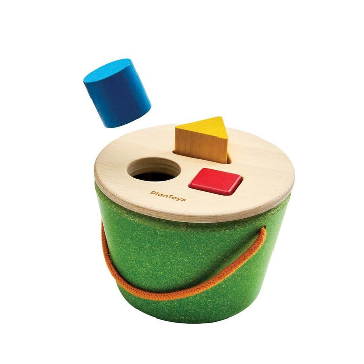 PlanToys Geo Shape Sorter Bucket with colorful wooden shapes and green base.