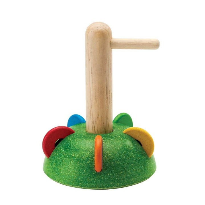 PlanToys Horizontal Stacking Set with colorful wooden discs shown placed in the slots in the green base.