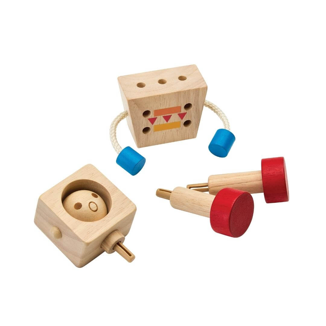 Dissassembled PlanToys Montessori Moodbot Wooden Robot with changeable facial expressions, poseable arms and legs, made from natural wood with red feet and blue hands.