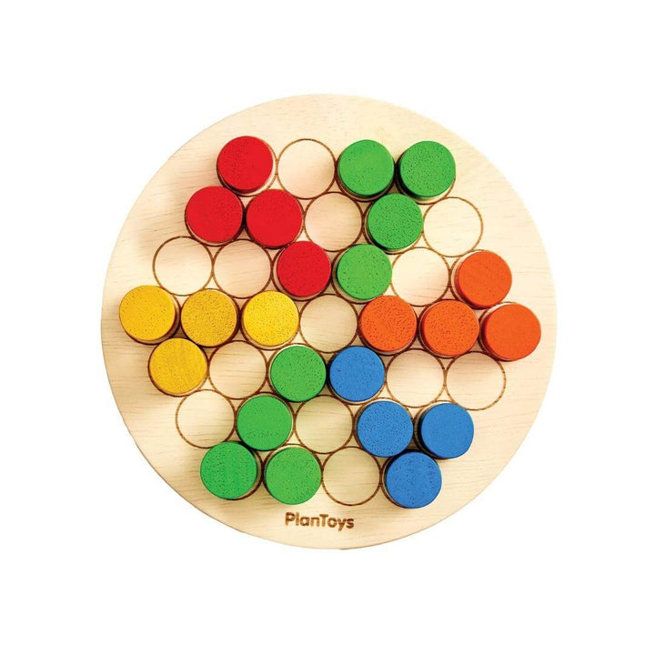 PlanToys Montessori Peg Board Set with colorful pegs and a board showing a colorful peg pattern.
