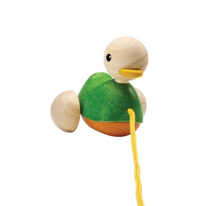PlanToys Montessori Pull-Along Duck in green with natural wood head, yellow beak, and yellow pull cord, designed for toddlers to walk and play.