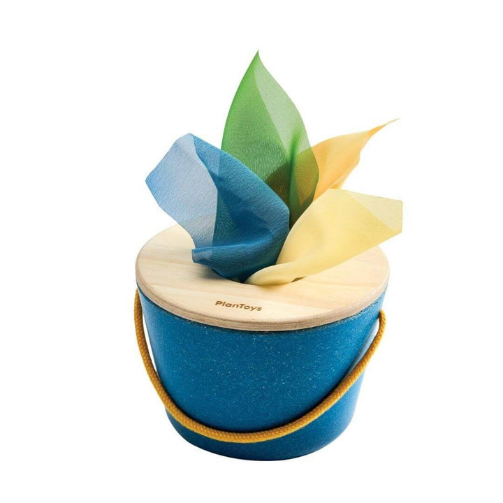 PlanToys Montessori Tissue Bucket with soft colorful cloths for babies to grasp and pull, designed to build fine motor skills and encourage independent play.