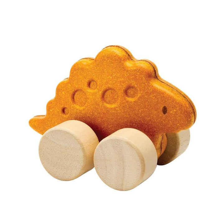 PlanToys Montessori Stego Car in orange, shaped like a stegosaurus with four natural wooden wheels, designed for toddlers to push and roll.