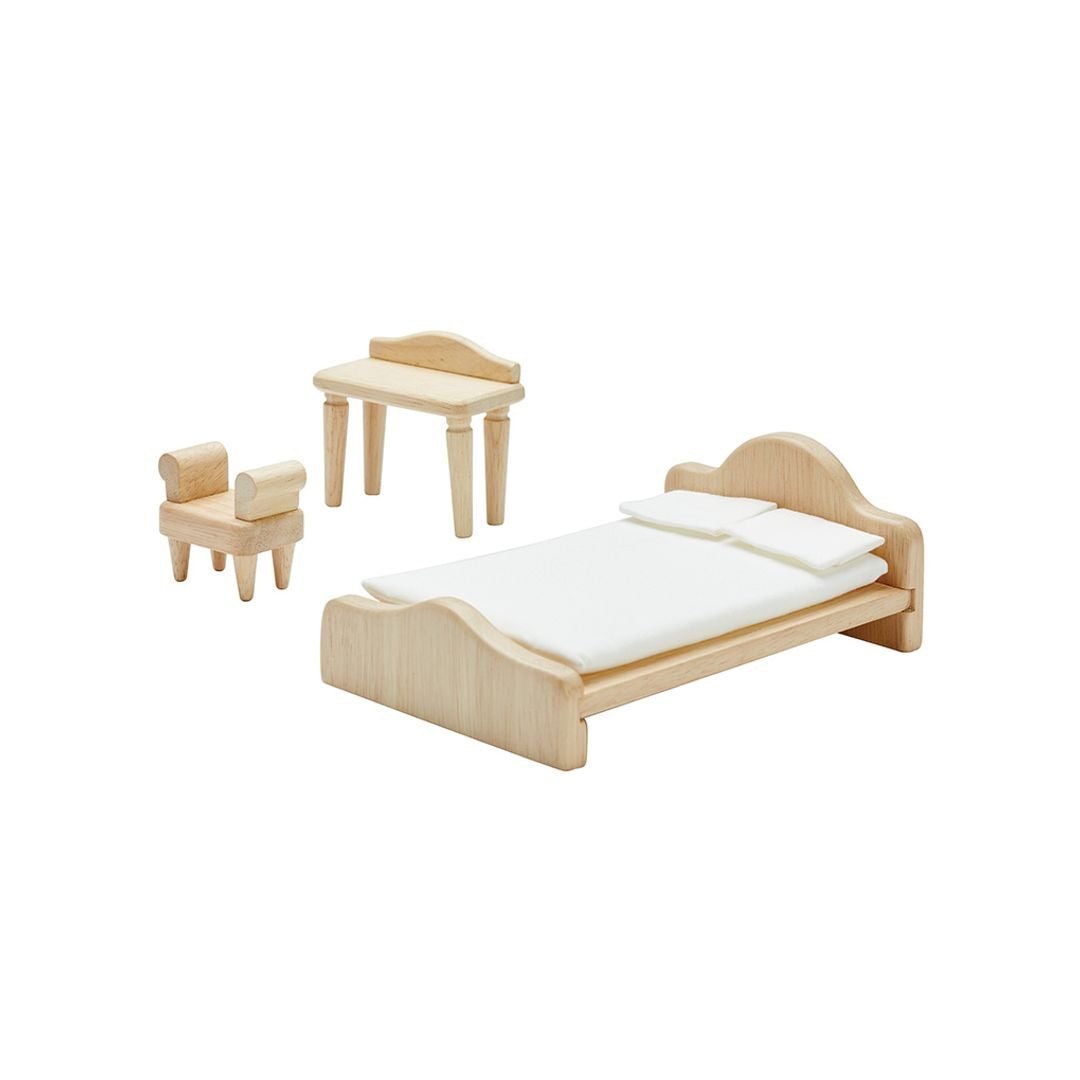 Assembled wooden bedroom furniture set displayed separately, showing intricate design and detail of each piece.