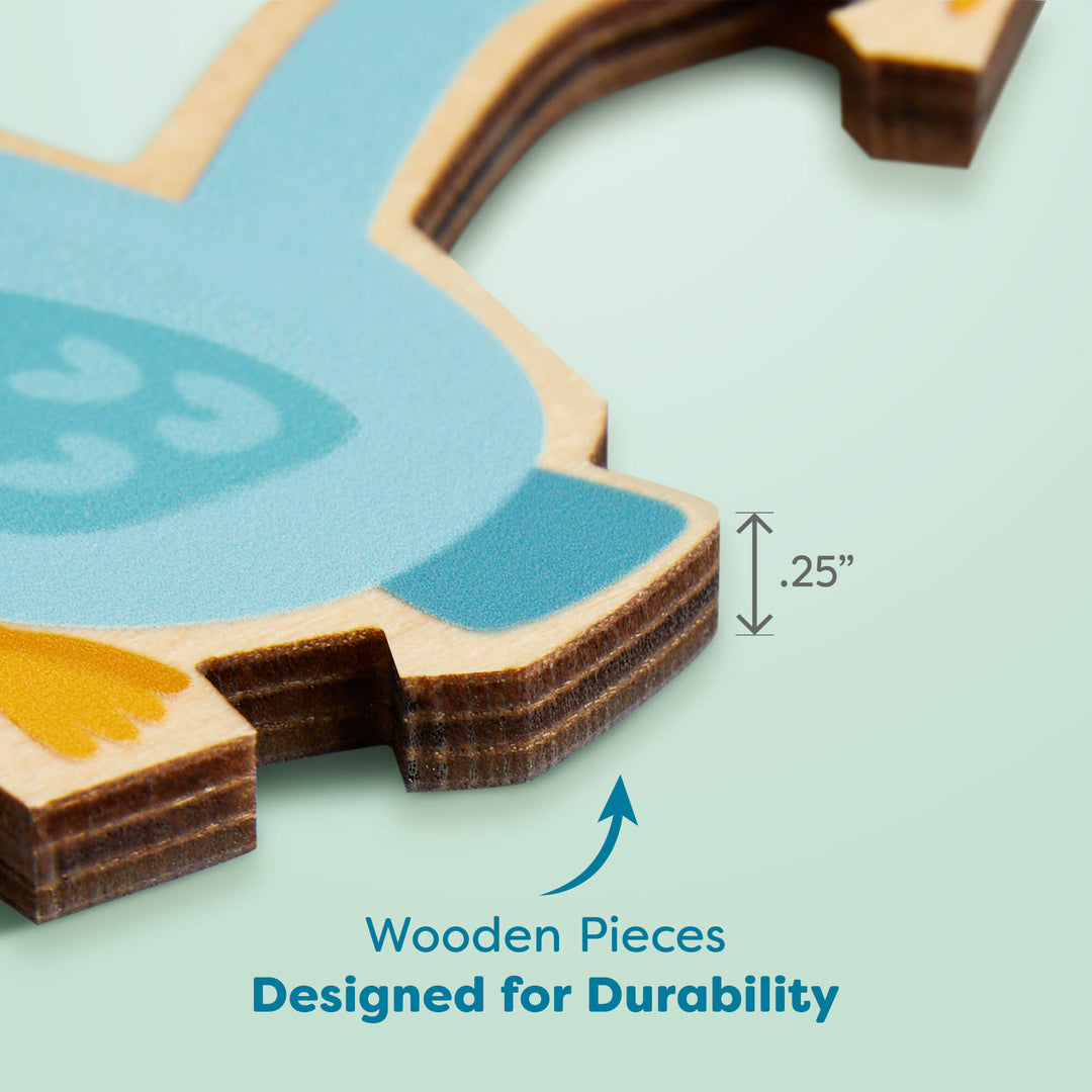 Close-up of a blue wooden puzzle piece, showing a labeled thickness of 0.25 inches. Text below reads "Wooden Pieces Designed for Durability"