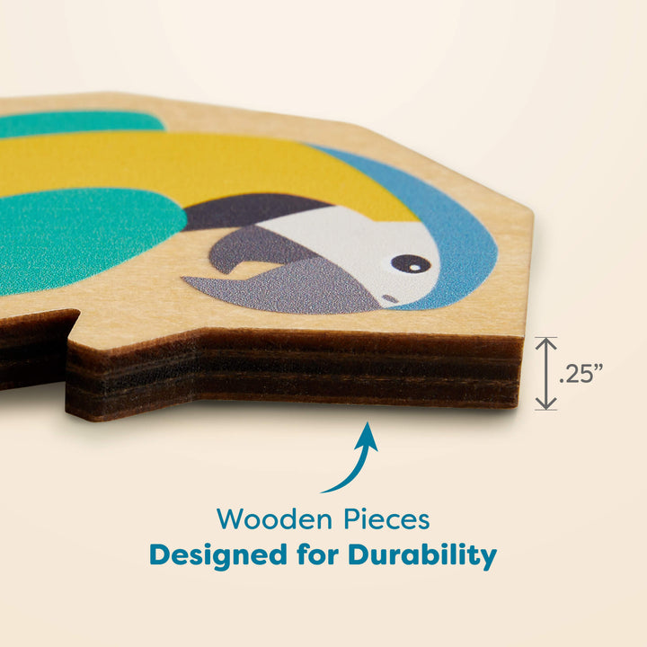 Close-up of a wooden puzzle piece featuring a parrot illustration, showing a labeled thickness of 0.25 inches. Text below reads "Wooden Pieces Designed for Durability"